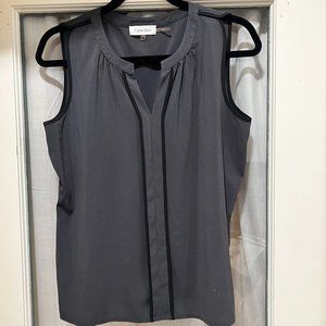 Calvin Klein Women's Sleeveless Top with an elegant black accent.